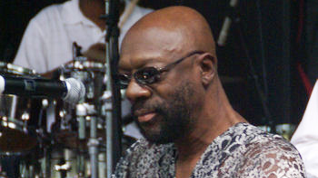 Isaac Hayes wearing glasses and sunglasses