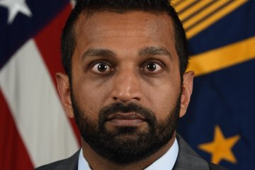 Dark-haired bearded man in suit